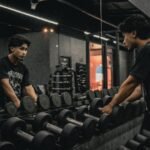 A couple of men working out in a gym