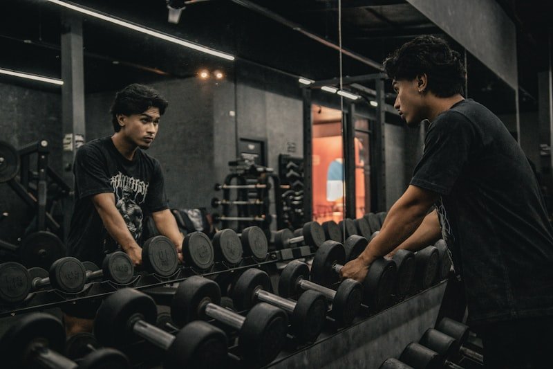 A couple of men working out in a gym